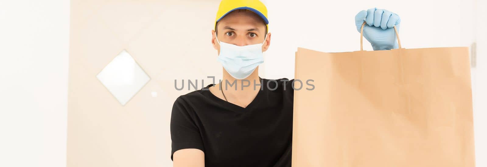 delivery man in protective gloves and a mask.