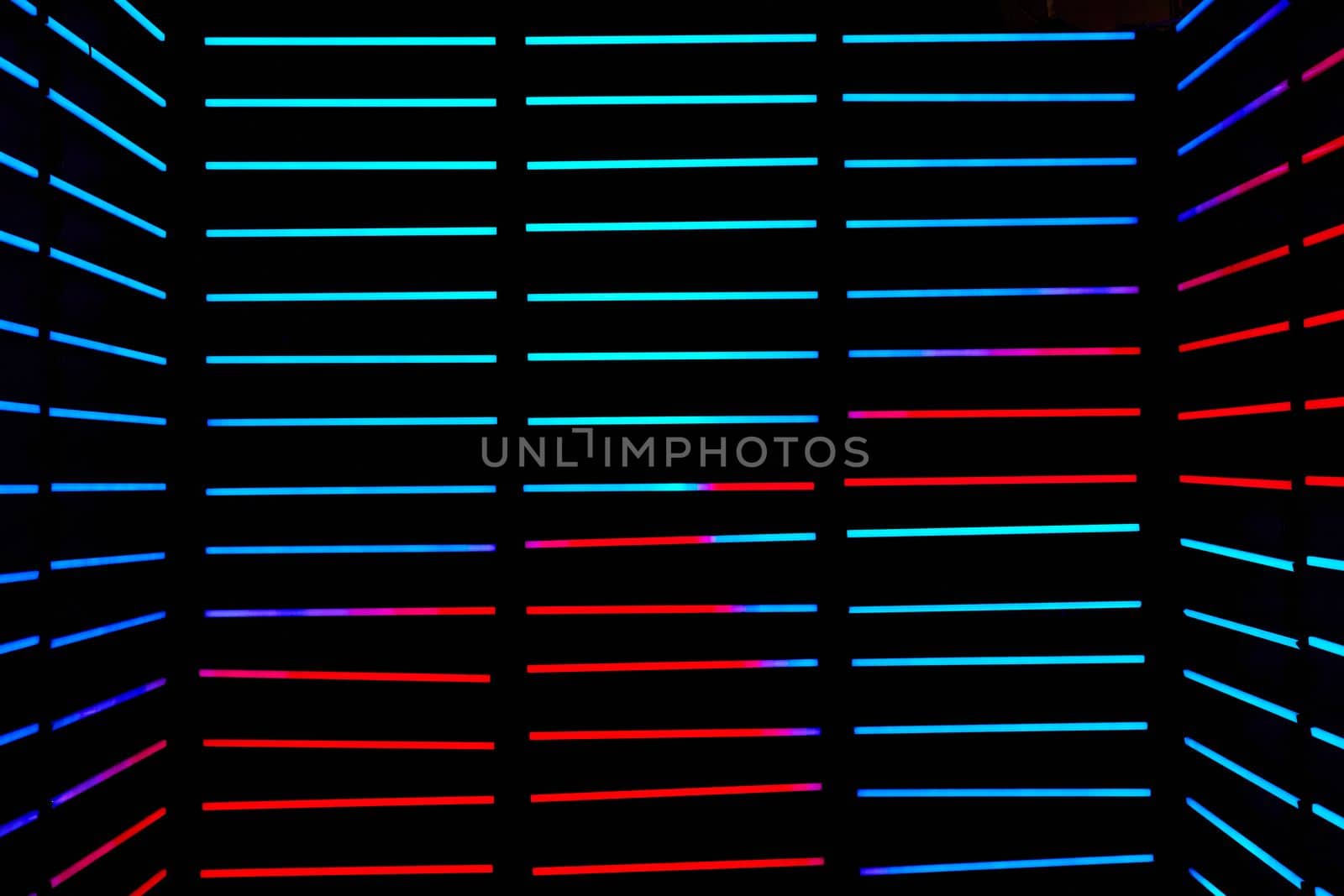 Abstract dark room with horizontal LED poles in blue and red by njproductions