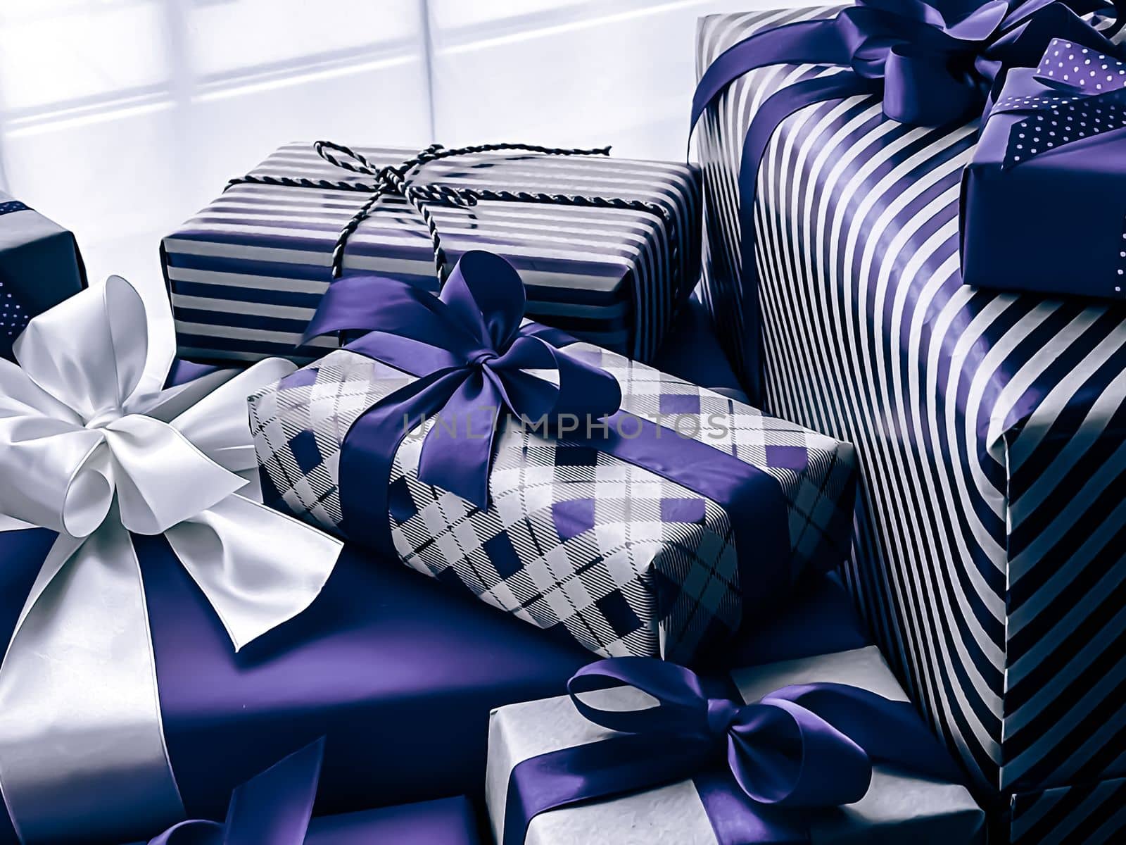 Holiday gifts and wrapped luxury presents, purple gift boxes as surprise present for birthday, Christmas, New Year, Valentines Day, boxing day, wedding and holidays shopping or beauty box delivery by Anneleven