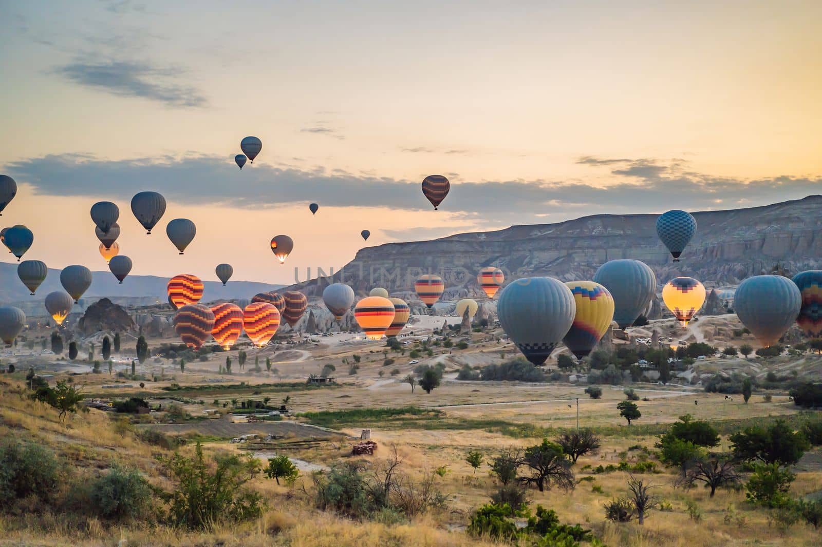 Colorful hot air balloon flying over Cappadocia, Turkey.