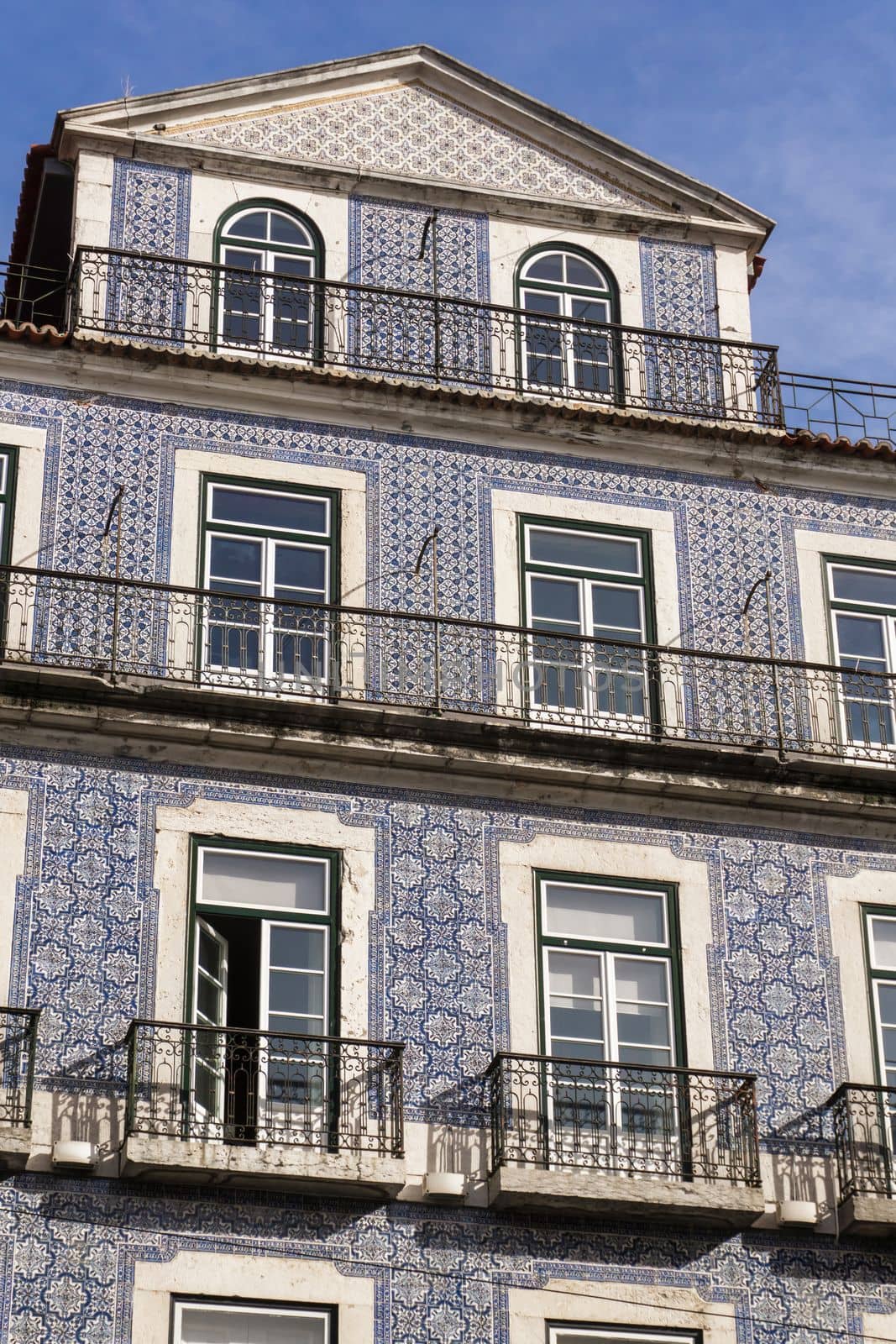 Portuguese house covered with blue tiles azulejo background