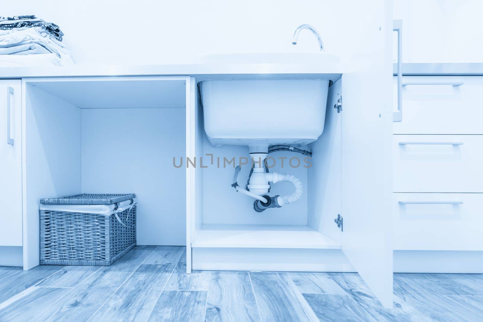Under the sink view in laundry room by Mariakray