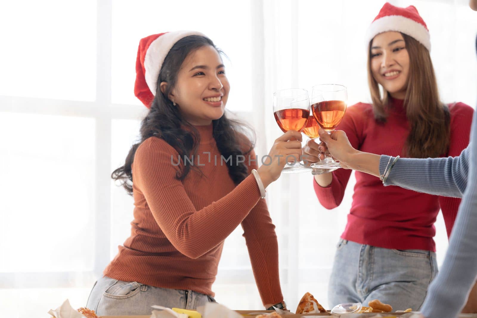 Group of young cute Asian girl gang best friends having party at office girl friends having fun and celebrating Girls drinking beer alcohol and eating pizza feeling happy enjoy by wichayada