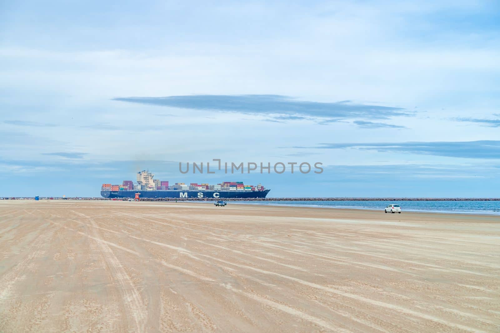 Brazil - March 23, 2022: cargo ship at the sandy beach by Edophoto