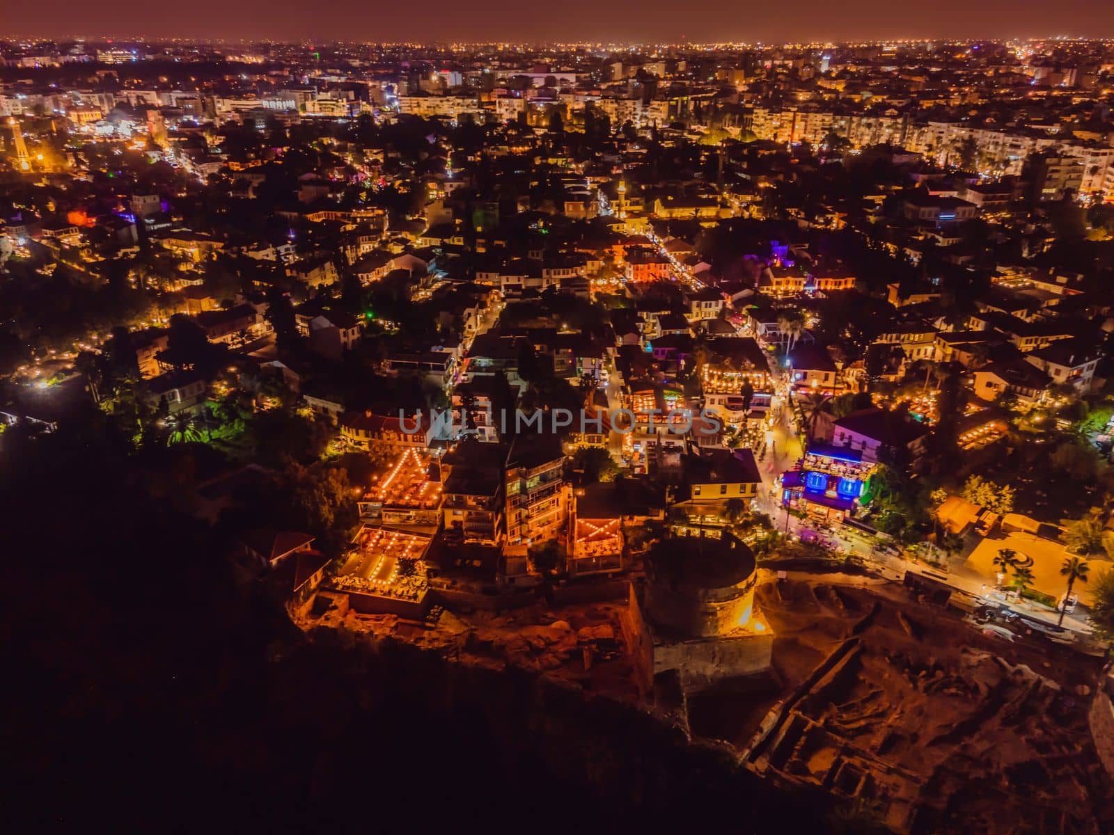 Night top aerial view of the old town Kaleici and old harbor in Antalya, Turkey. Turkey is a popular tourist destination.