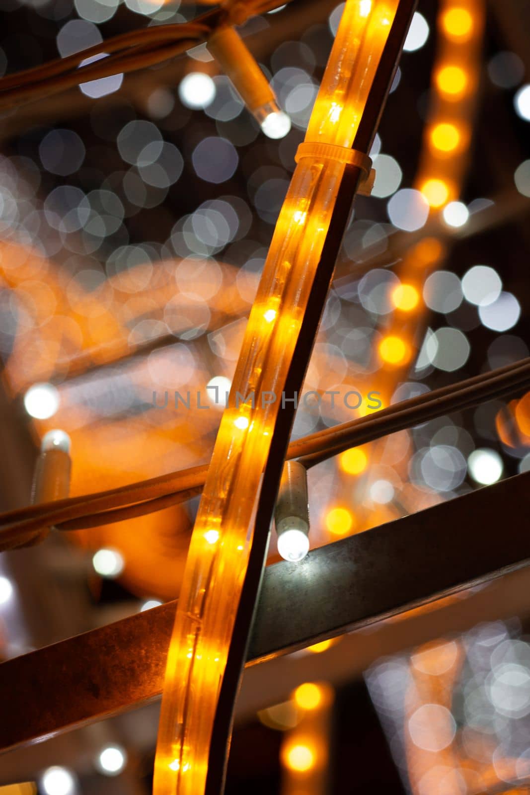 Holiday illumination of orange LEDs on a blue blurred background by gelog67