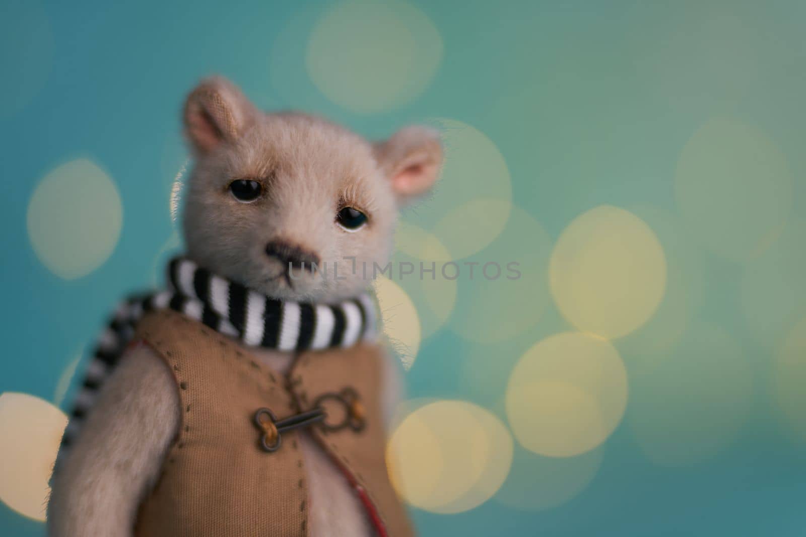 Cute teddy bear isolated on Christmas light background. Holiday glowing backdrop. Defocused Background With Blinking light. Blurred Bokeh. by Costin