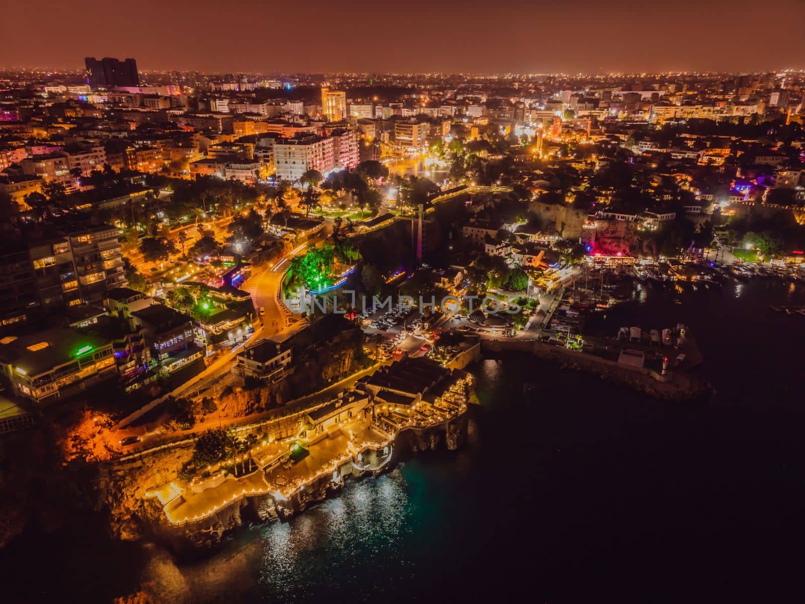 Night top aerial view of the old town Kaleici and old harbor in Antalya, Turkey. Turkey is a popular tourist destination by galitskaya