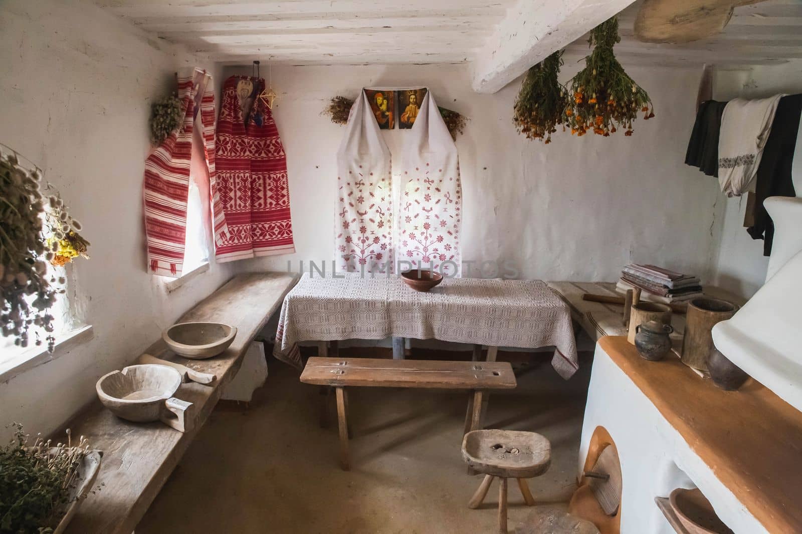 Ancient traditional Ukrainian house. Interior and household items.