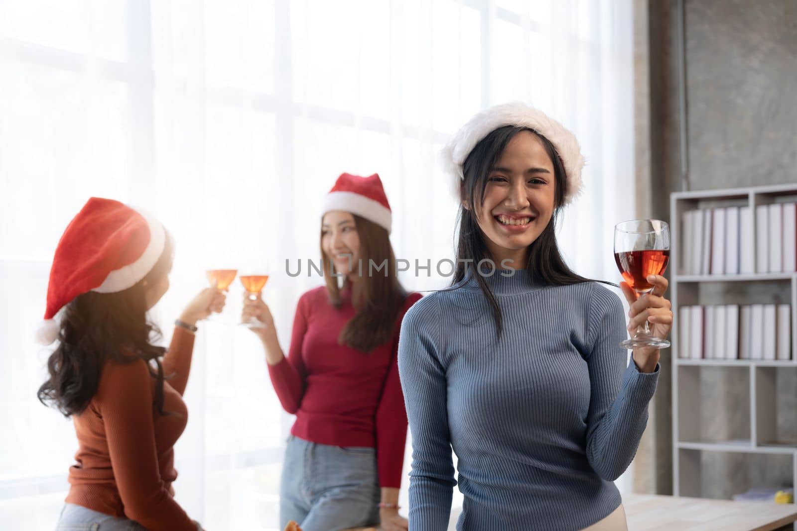 Group of young cute Asian girl gang best friends having party at office girl friends having fun and celebrating Girls drinking beer alcohol and eating pizza feeling happy enjoy by wichayada