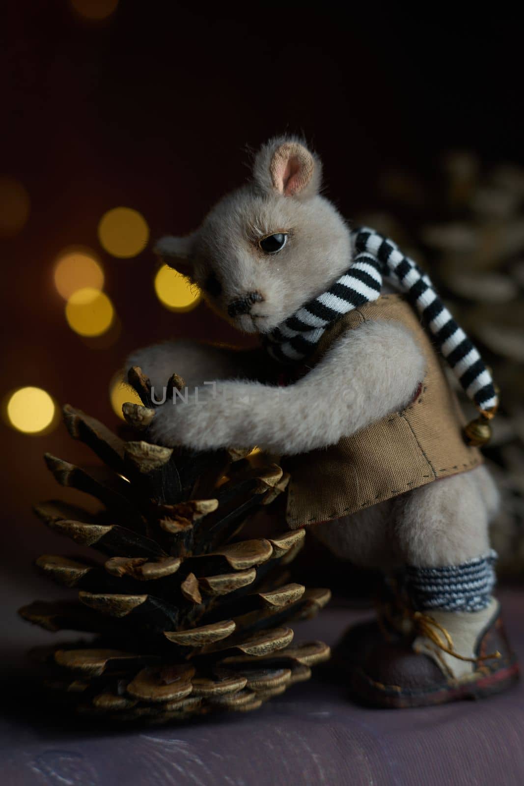 a photo of a handmade collectible teddy bear, suitable for printing in a calendar card or for inserting into a frame for delivering aesthetic pleasure in your free time. High quality photo