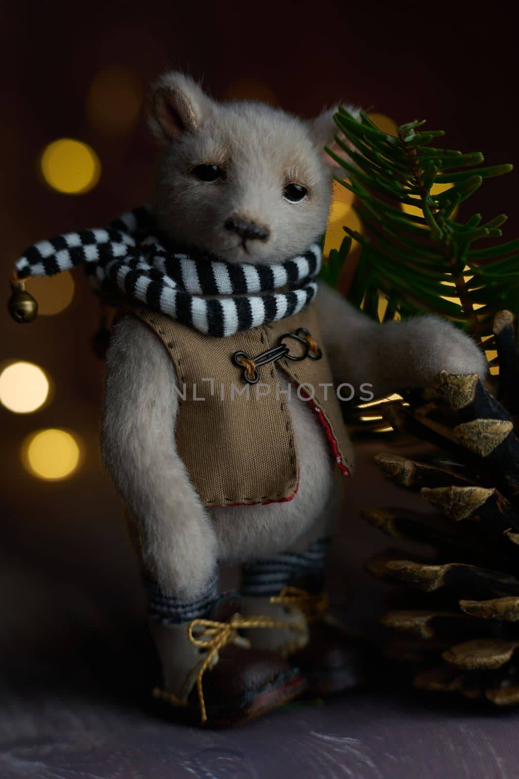 a photo of a handmade collectible teddy bear, suitable for printing in a calendar card or for inserting into a frame for delivering aesthetic pleasure in your free time. High quality photo