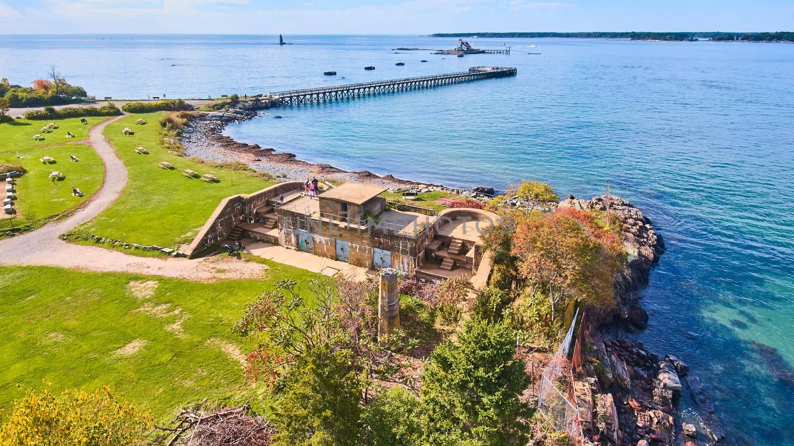 Old military fort in park with view of Maine ocean and pier to view lighthouse by njproductions