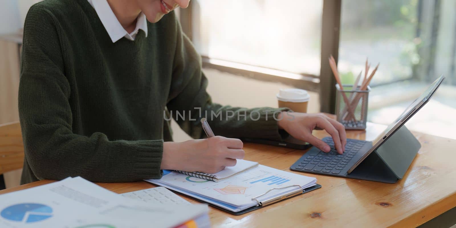 Asian Business woman making prepare presentation or important email of financial. Business Accountant working in home office