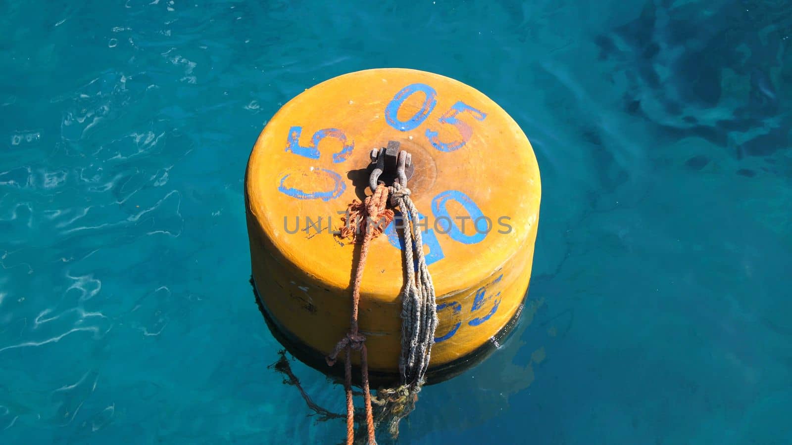 summer, sea, in transparent bluish water floats orange buoy. High quality photo
