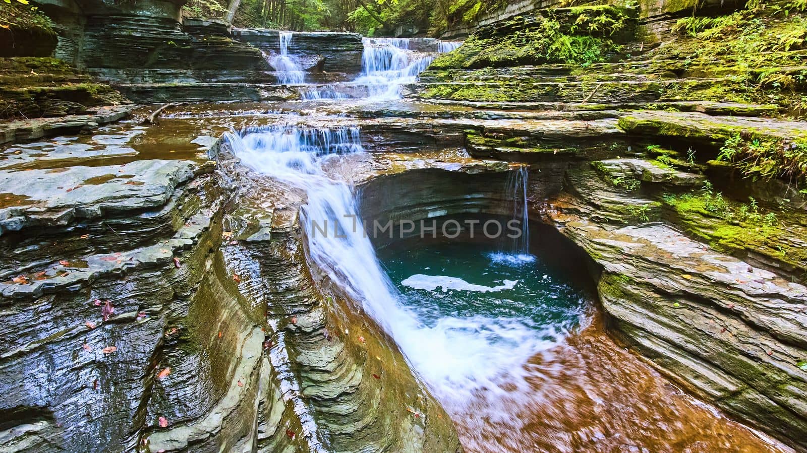 Image of Detail of waterfalls next to rocky gorge with layers