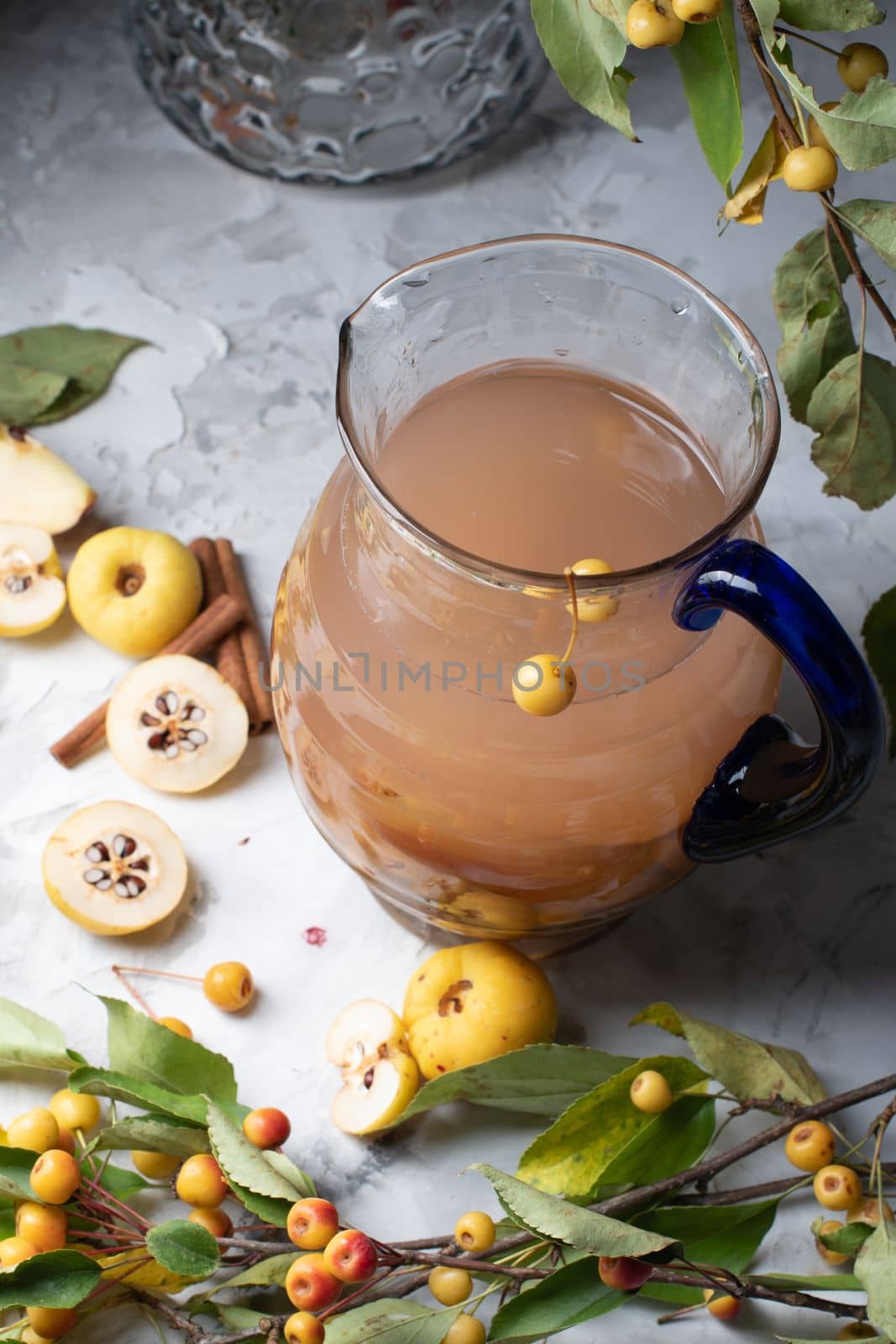 Assorted compote of apples and Japanese quince in a jug, delicious, vitamin drink, chaenomeles. High quality photo