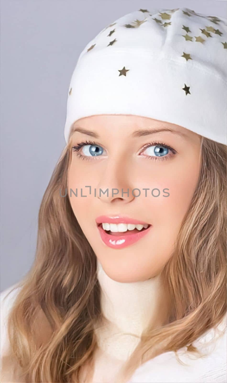 Elegant and fashionable lady wearing a white benny hat to wish you a Merry Christmas and a Happy New Year. Gorgeous brunette girl enjoying the winter holidays, Christmas, and New Year.