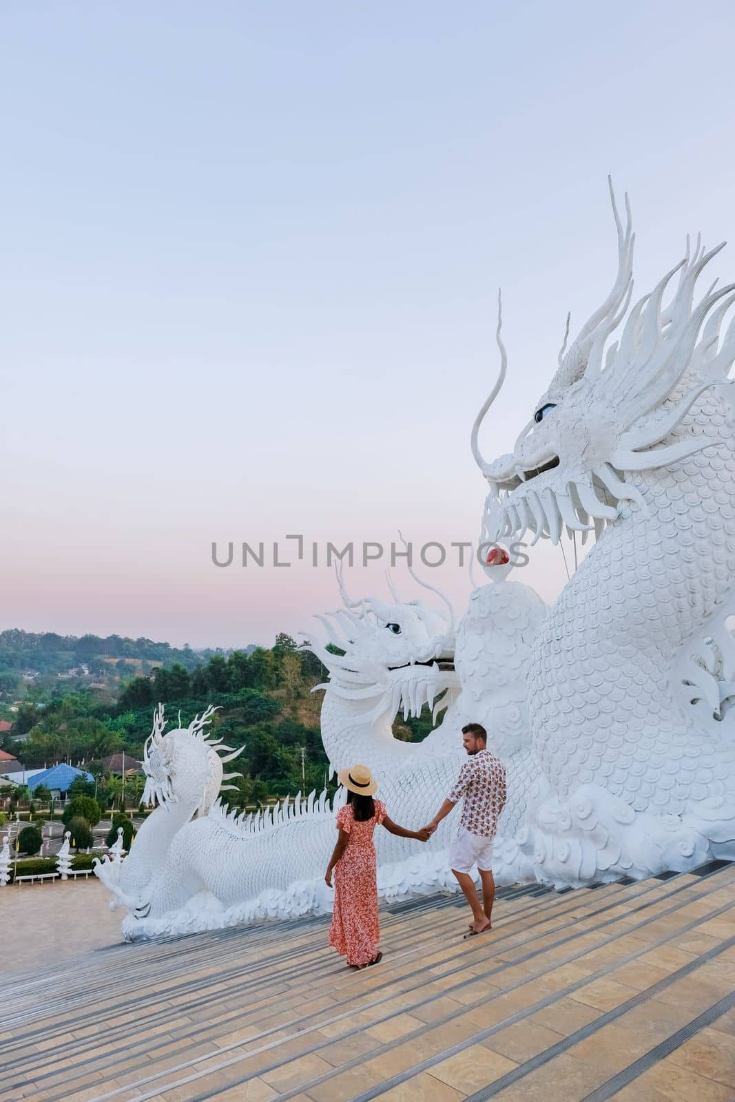 A couple visits Wat Huay Pla Kang Chiang Rai Thailand, Wat Hua Pla Kang is one of the most impressive temples in Chiang Rai.