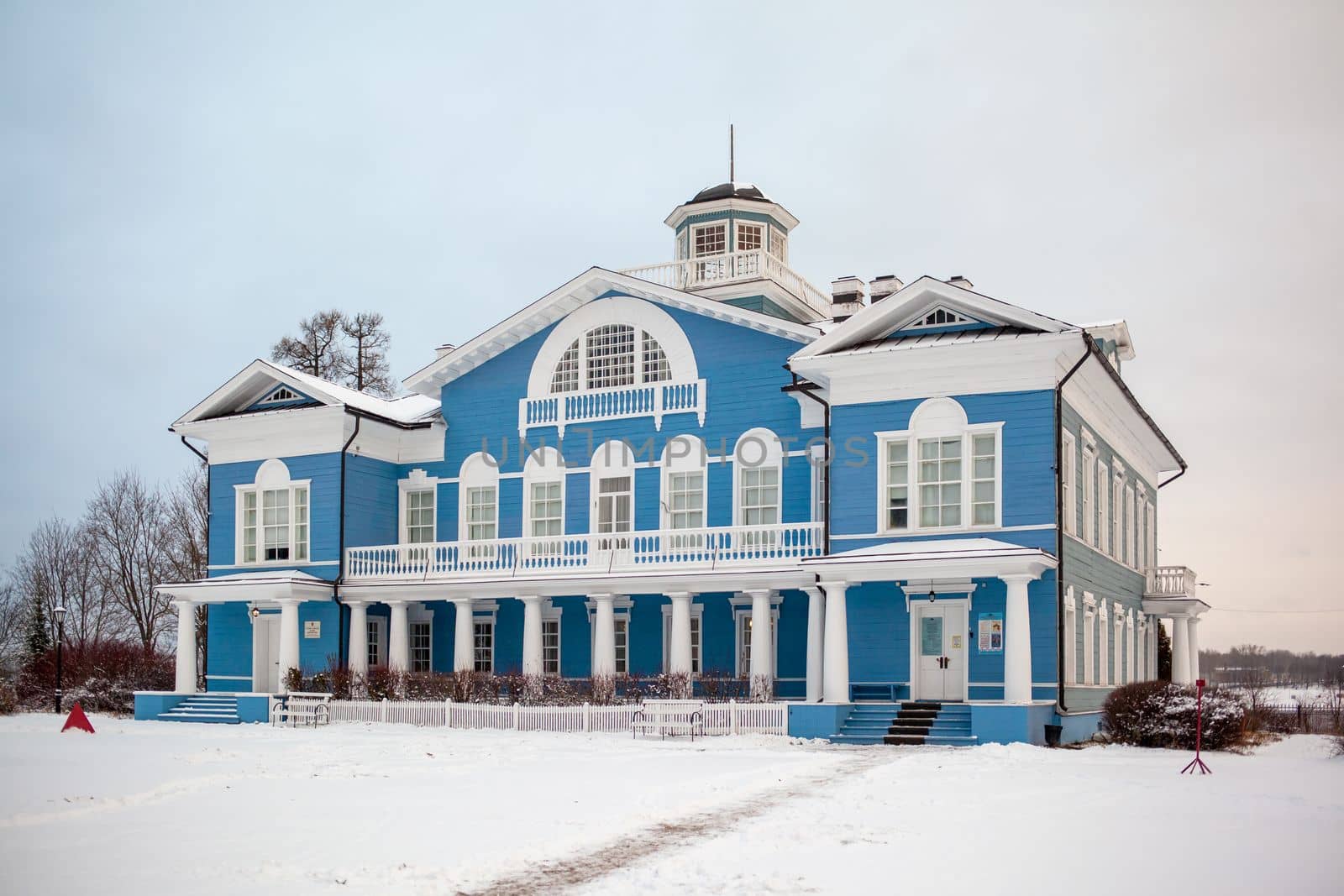 An old beautiful mansion with a wooden veranda, built in the 19th century. A big old house with a garden in Cherepovets, Russia. The building houses a museum 