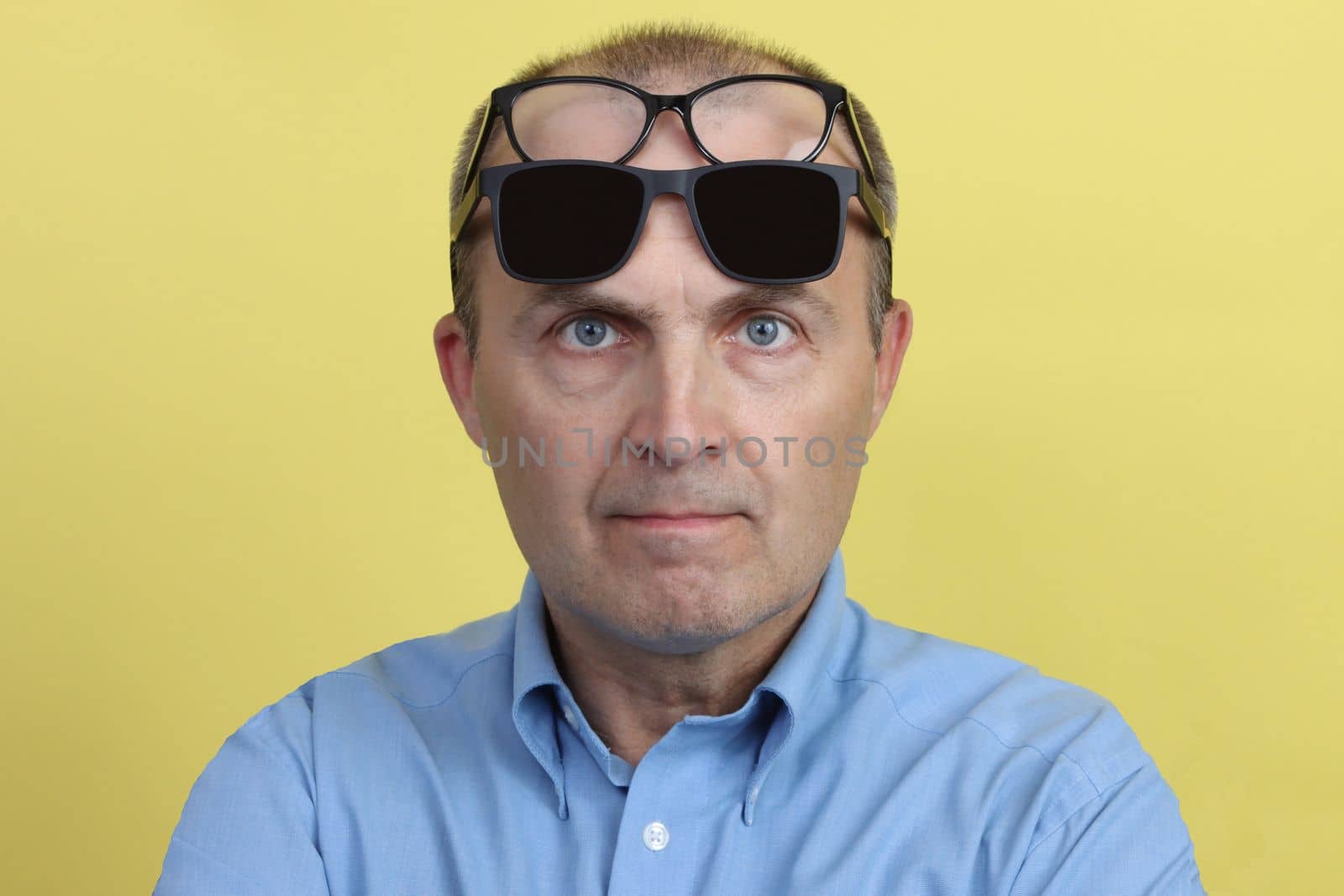 Close-up portrait of a handsome elderly man with glasses. by gelog67