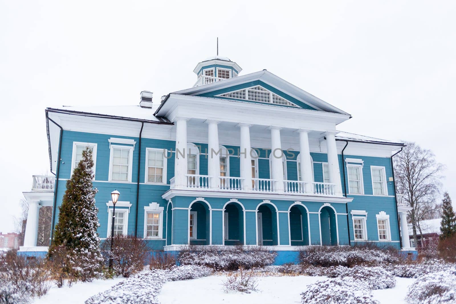 An old beautiful mansion with a wooden veranda, built in the 19th century. A big old house with a garden in Cherepovets, Russia. The building houses a museum 