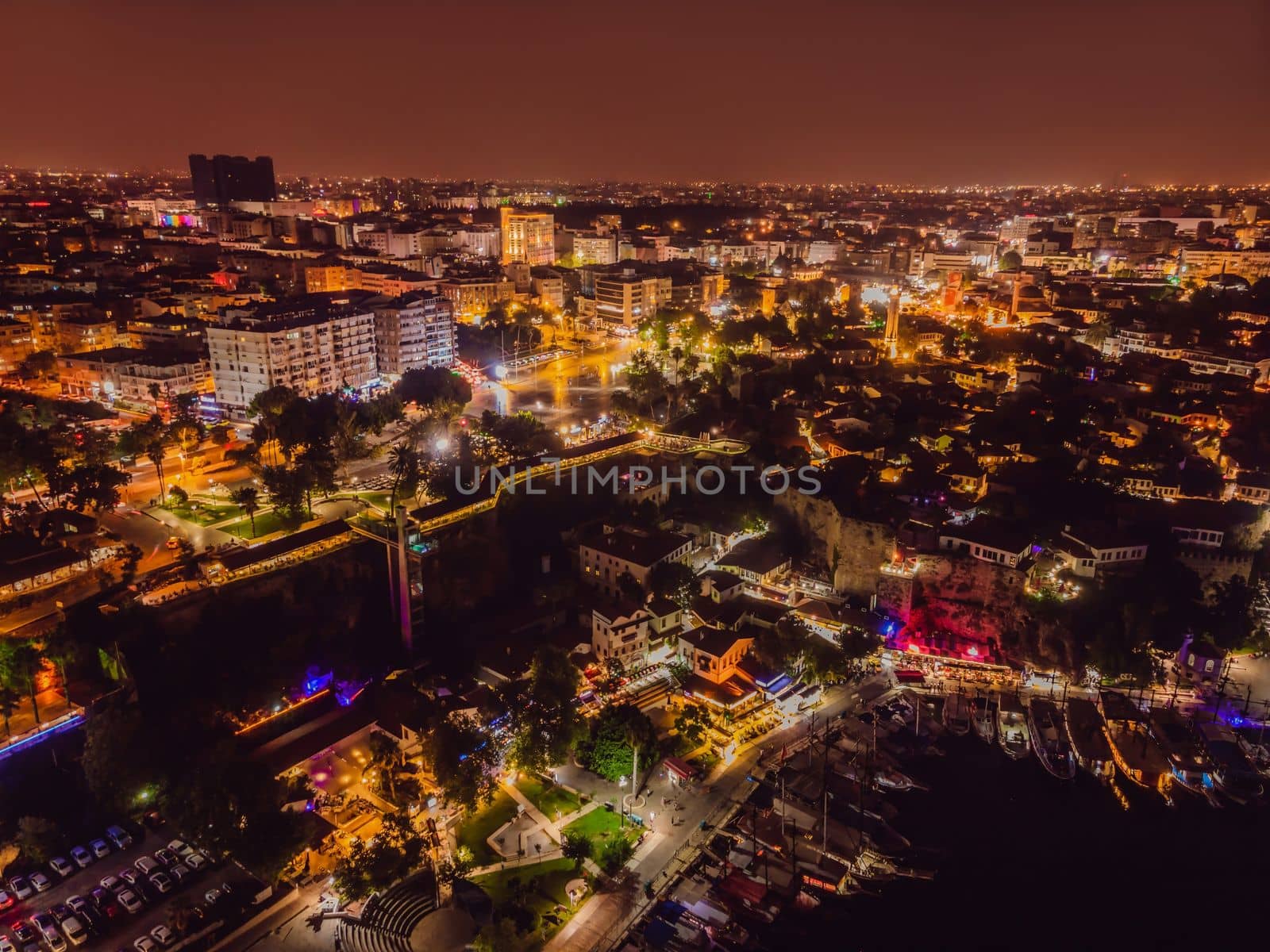 Night top aerial view of the old town Kaleici and old harbor in Antalya, Turkey. Turkey is a popular tourist destination.