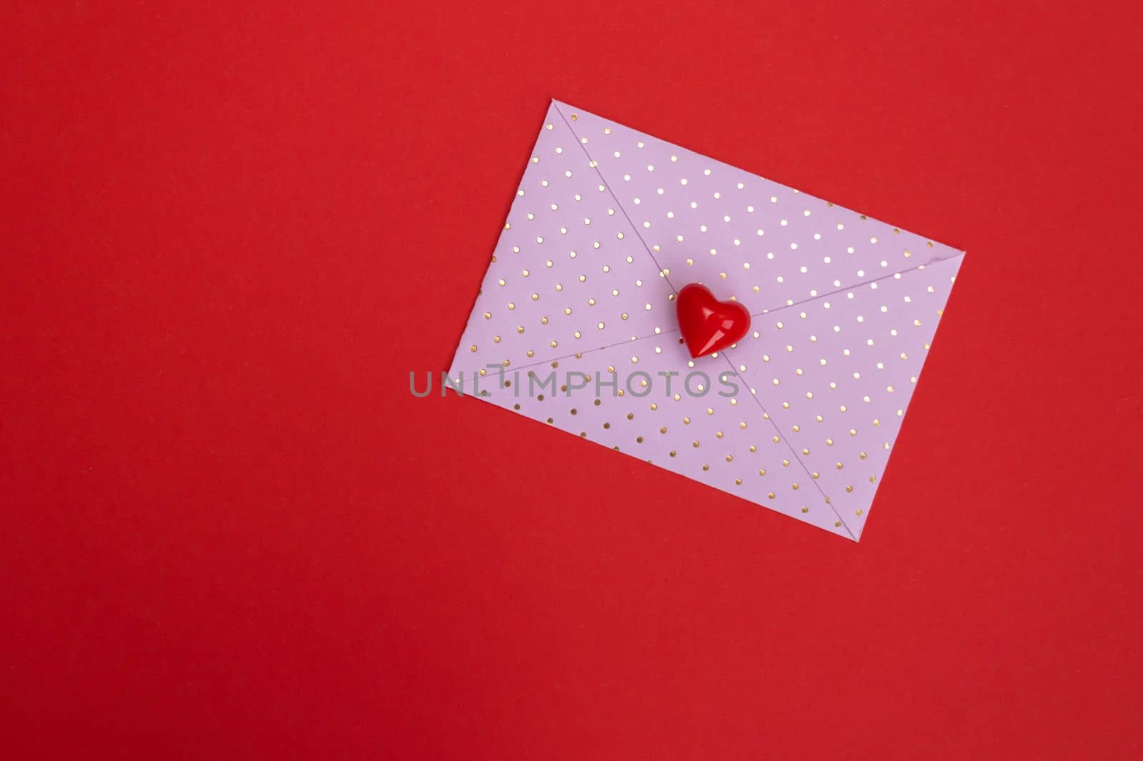 Valentines day red heart on same color background. Monochromatic vivid color. Valentine's day concept. Close up, copy space