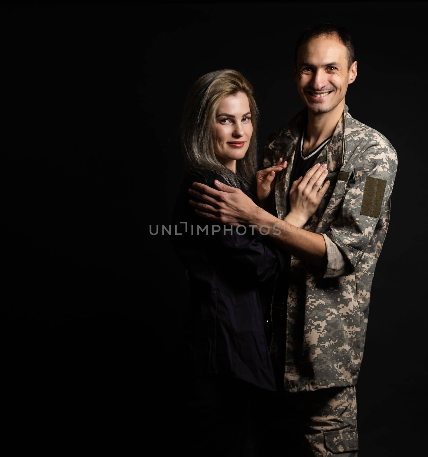 military man and his wife on a black background by Andelov13