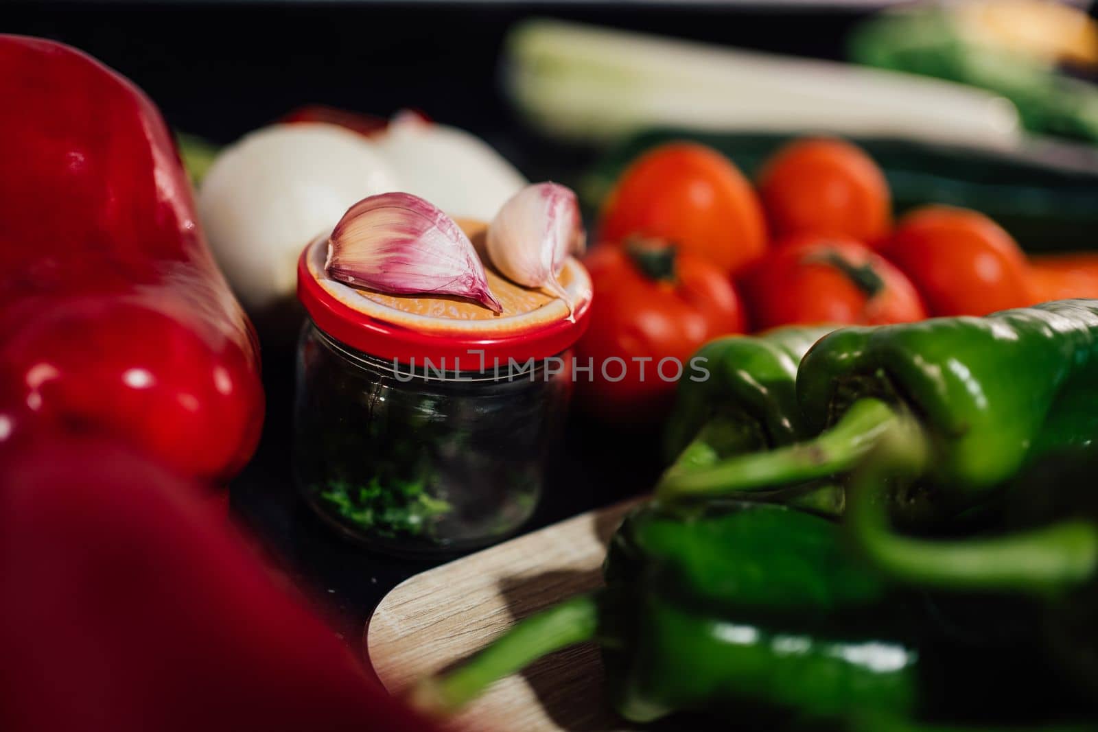 Fresh vegetables, fruits and seeds ready to cook over black background.