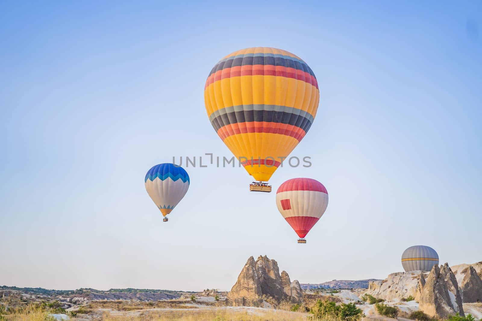 Colorful hot air balloon flying over Cappadocia, Turkey.