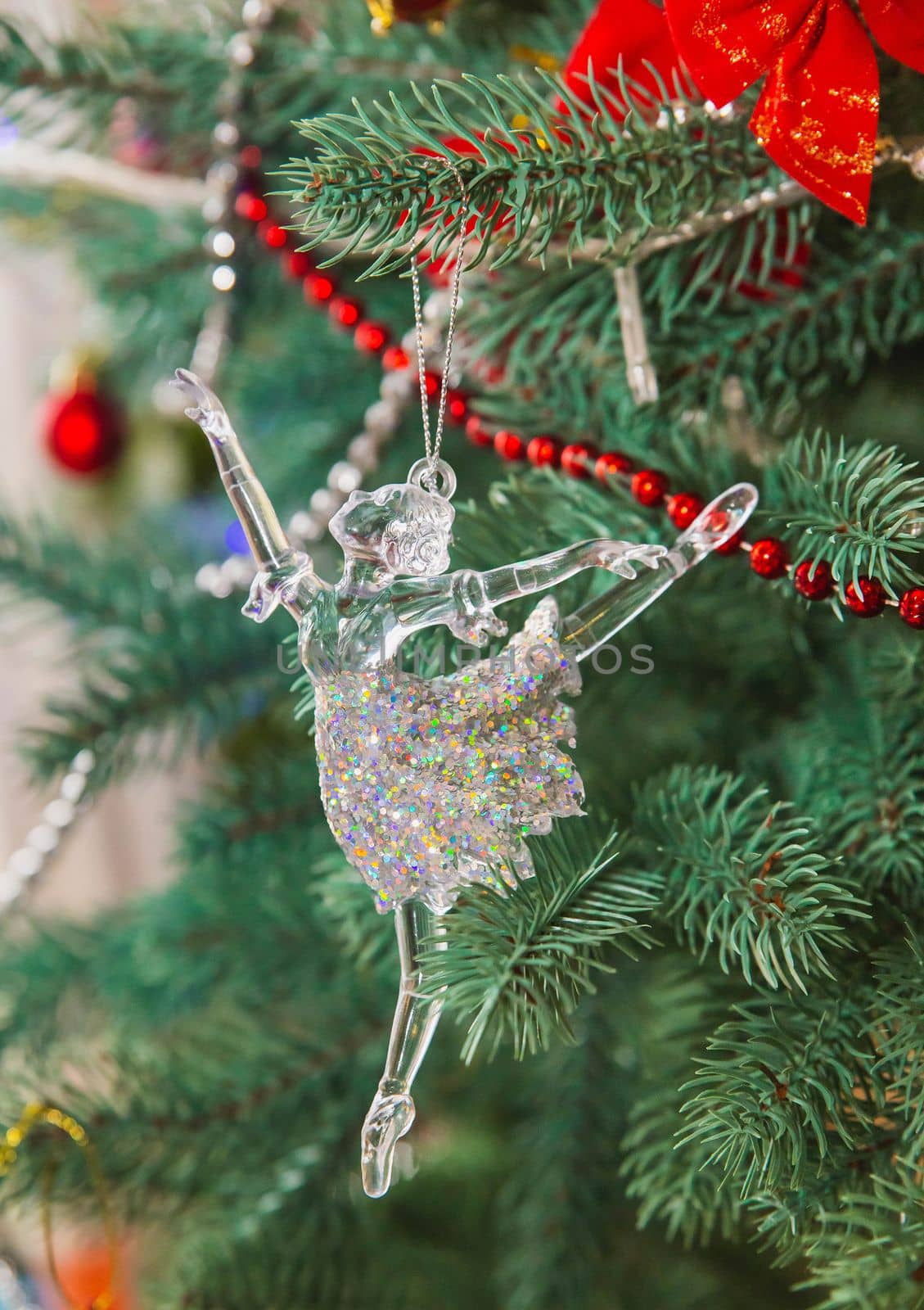 beautiful glass ballerina toy on christmas tree.