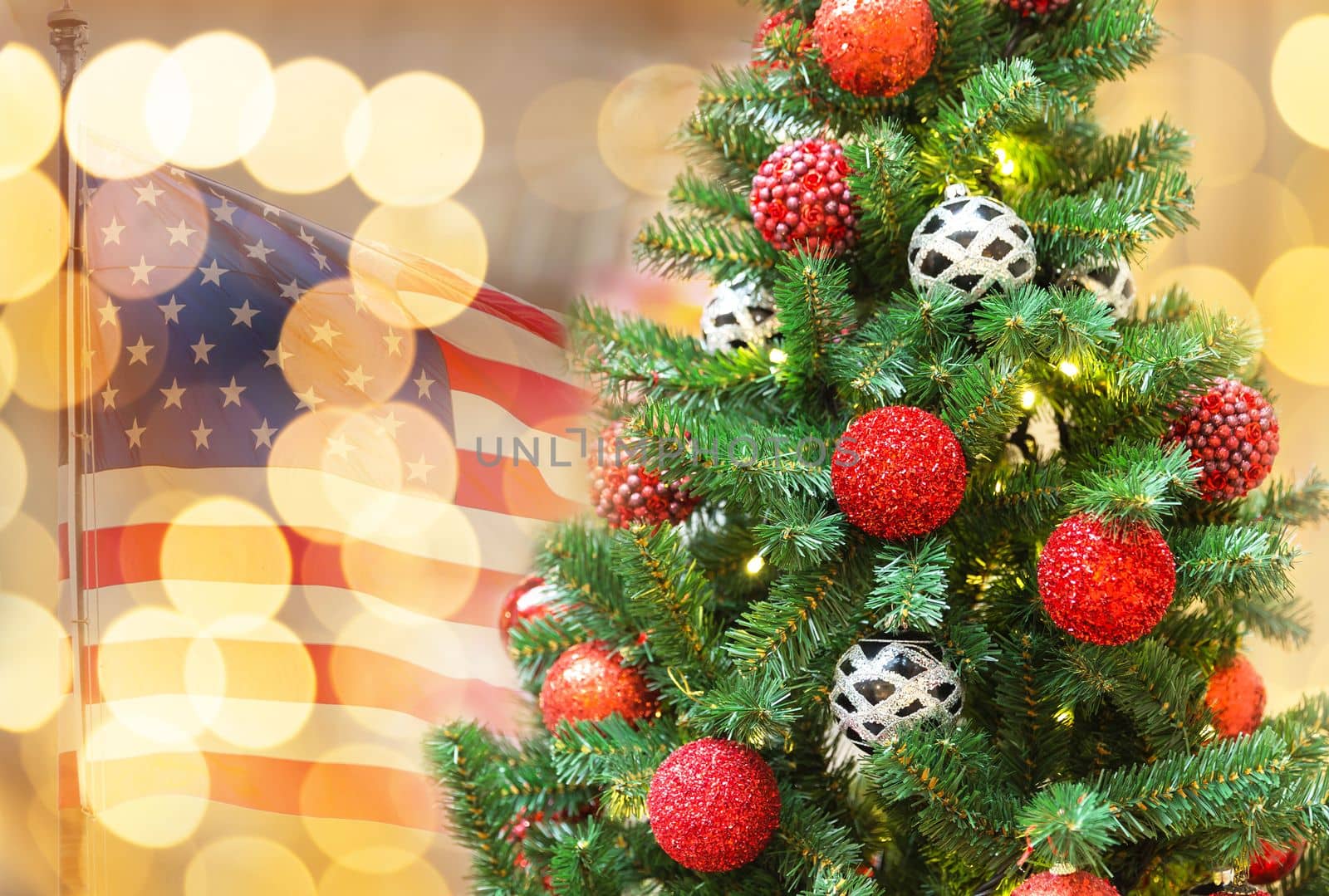 Christmas tree in shopping mall with american flag on background by Mariakray
