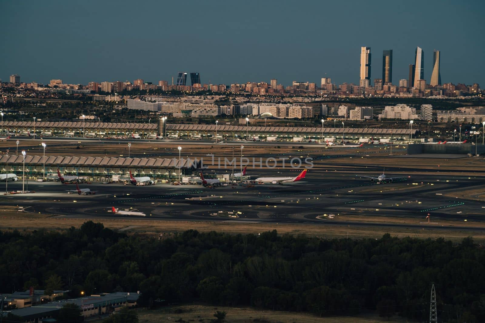 Madrid barajas airport and city skyline in the background.