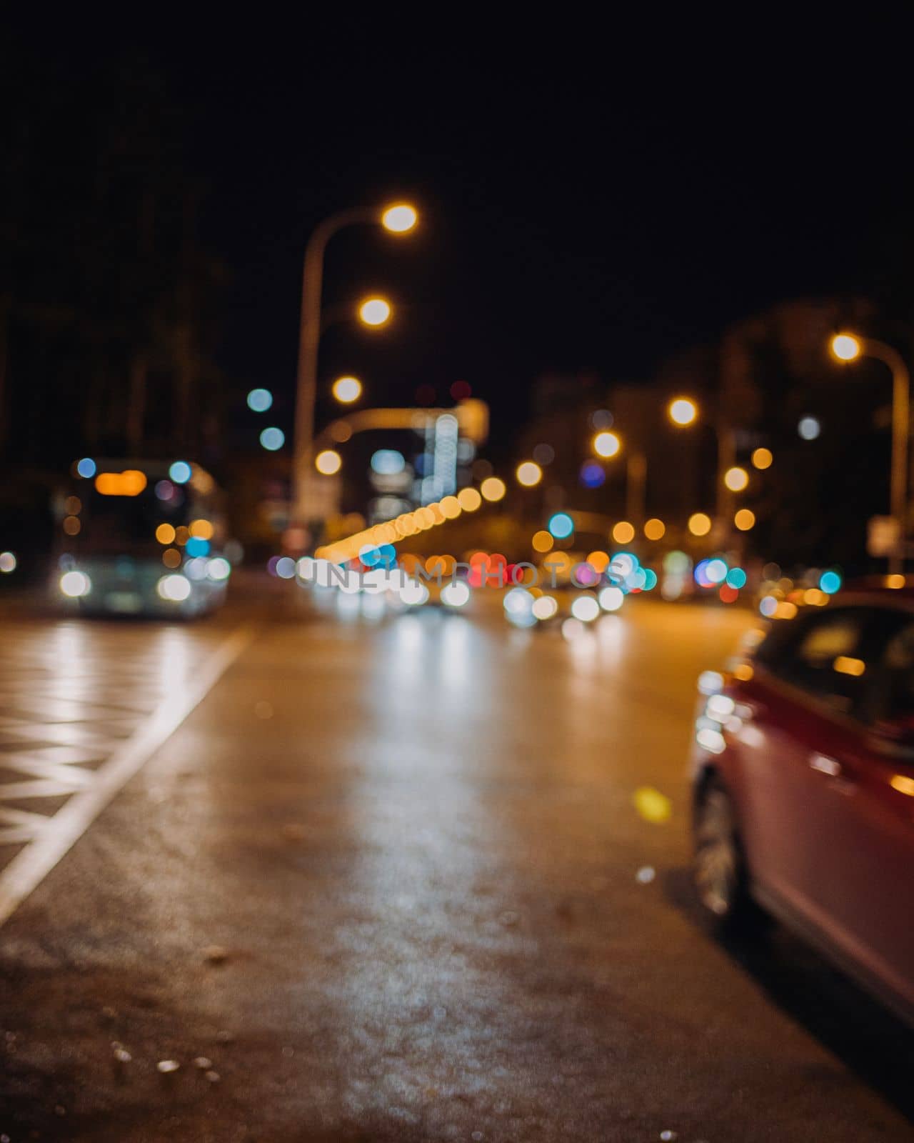 Blurred on purpose. Urban traffic lights at night. City life concept in Madrid , spain by papatonic