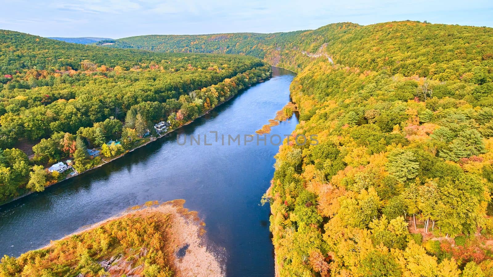 Image of Aerial over stunning Delaware River with fall foliage forests around and hills