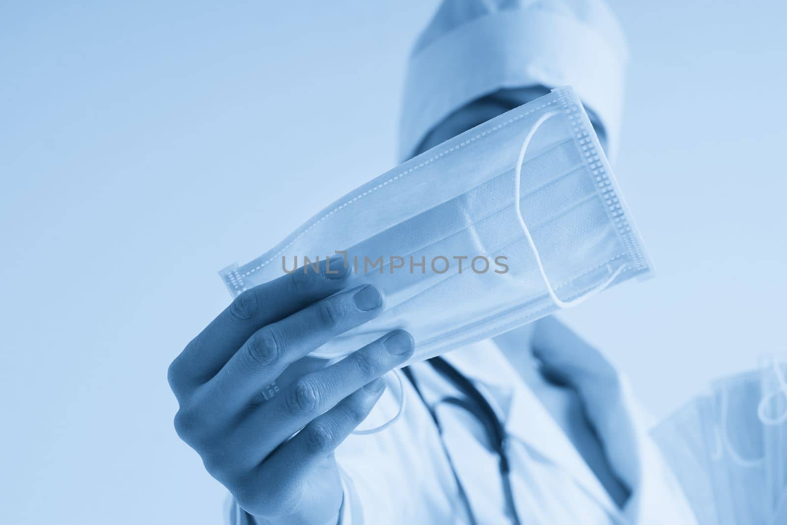 Doctor or nurse recommend to use protective face mask to protect from virus infection, studio shoot with white background