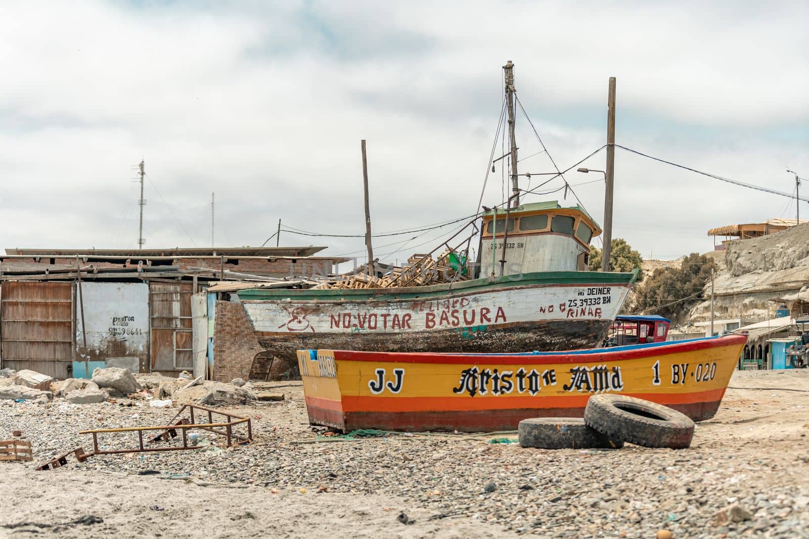 Peru - September 21. 2022: boats on the shore of a fishing village.
