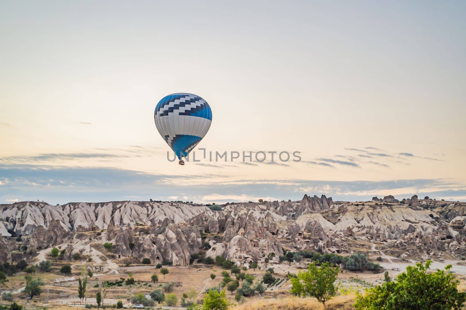 Colorful hot air balloon flying over Cappadocia, Turkey.