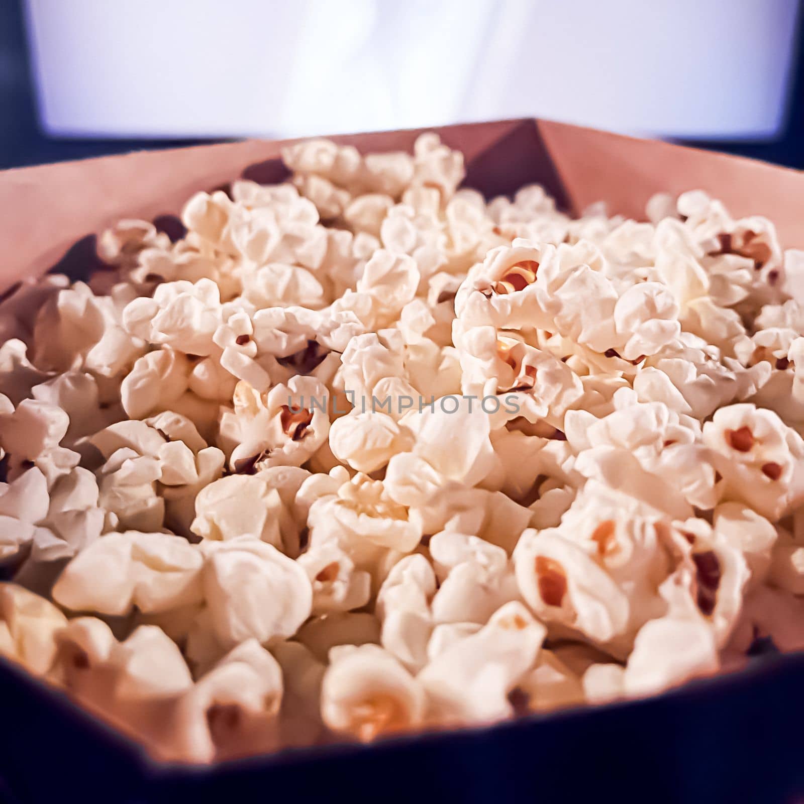 Cinema and entertainment, popcorn box in the movie theatre for tv show streaming service and film industry production by Anneleven