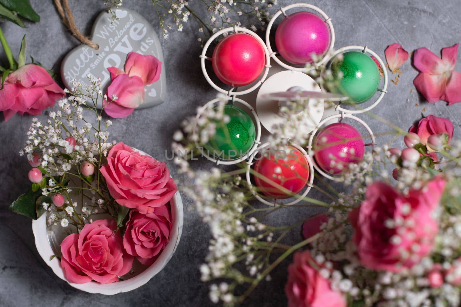 colorful easter eggs scattered on gray concrete background, top view, High quality photo