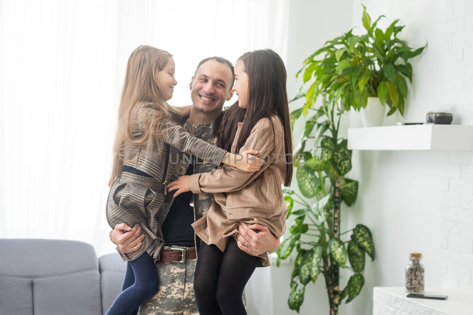 beautiful little daughters and military father at home by Andelov13
