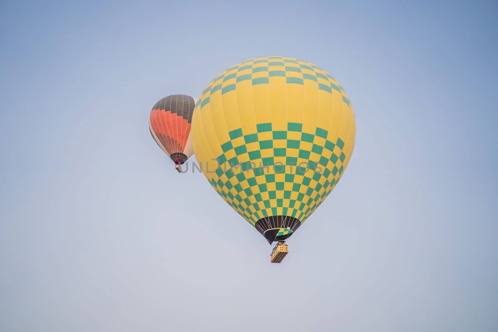 Beautiful hot air balloons over blue sky.