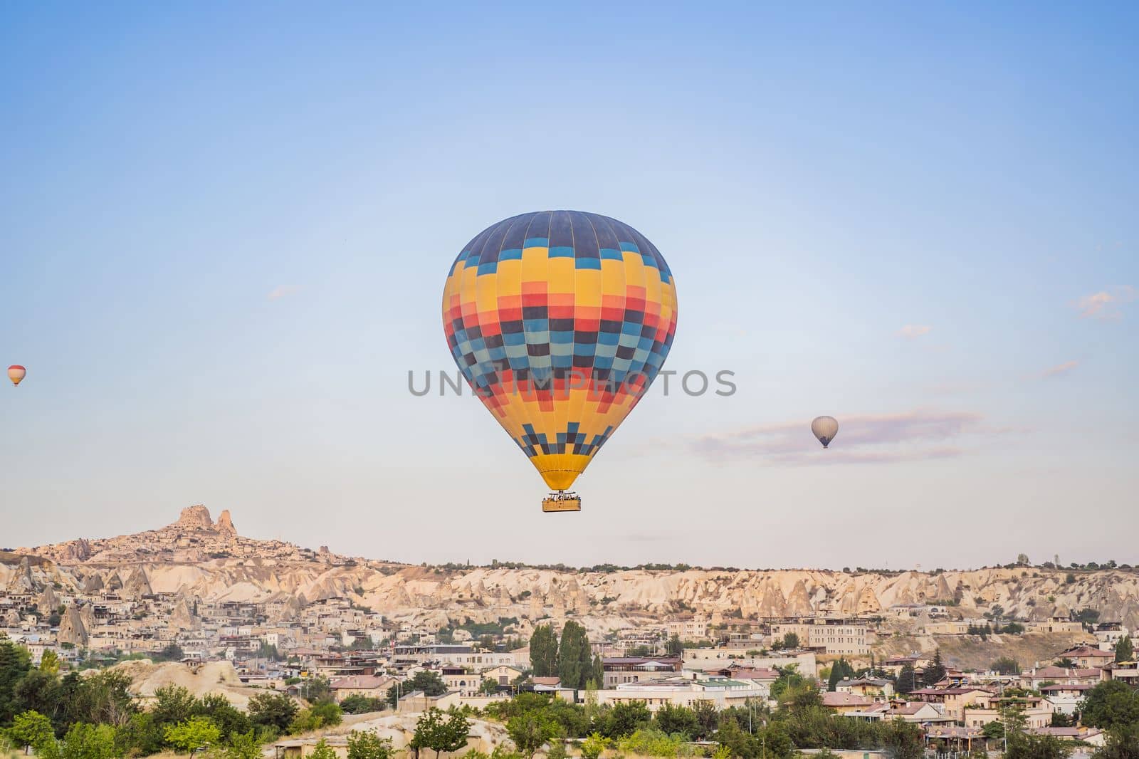 Colorful hot air balloon flying over Cappadocia, Turkey by galitskaya