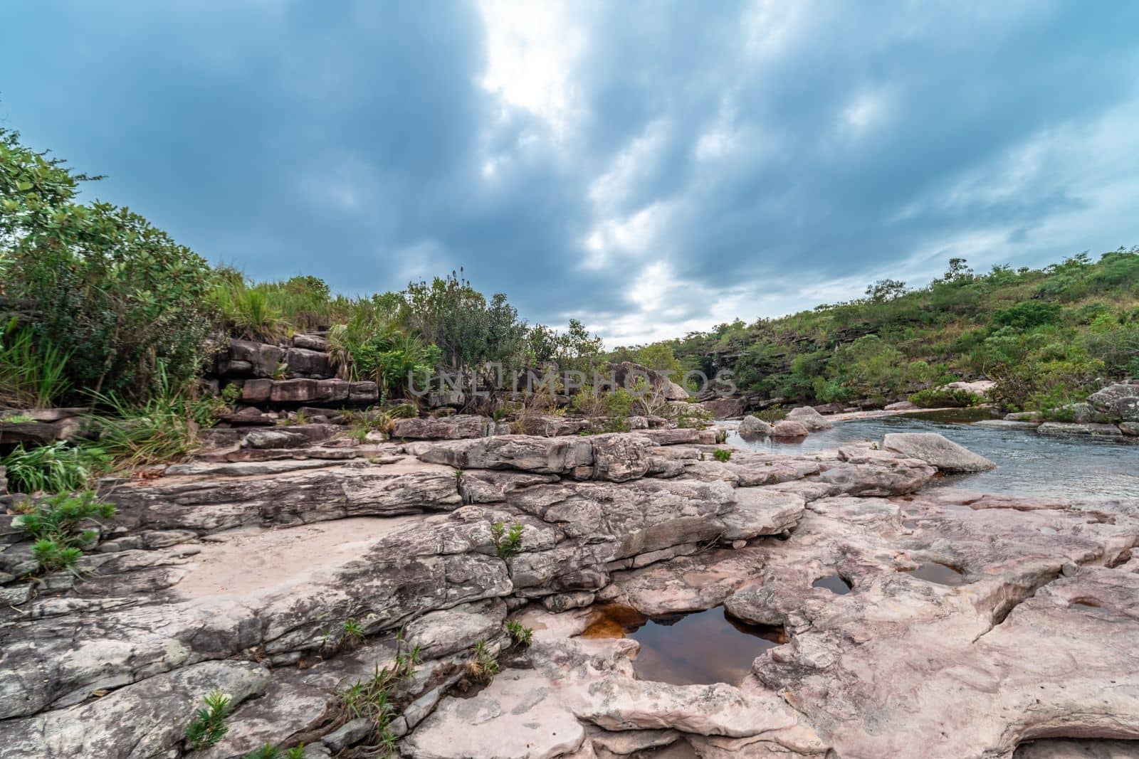 A mountain river flows through rocks in South America by Edophoto