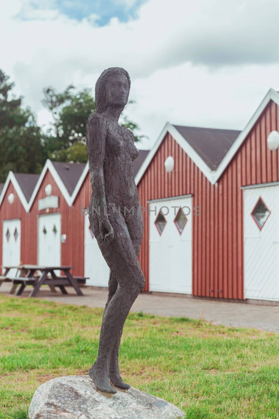 Wirksund, Denmark, August 2021: Metal statue of a woman on the north sea coast