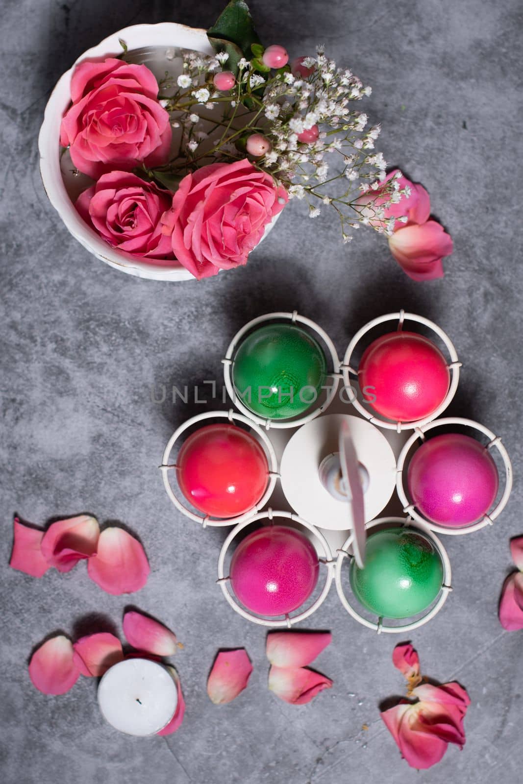 colorful easter eggs scattered on gray concrete background, top view, High quality photo