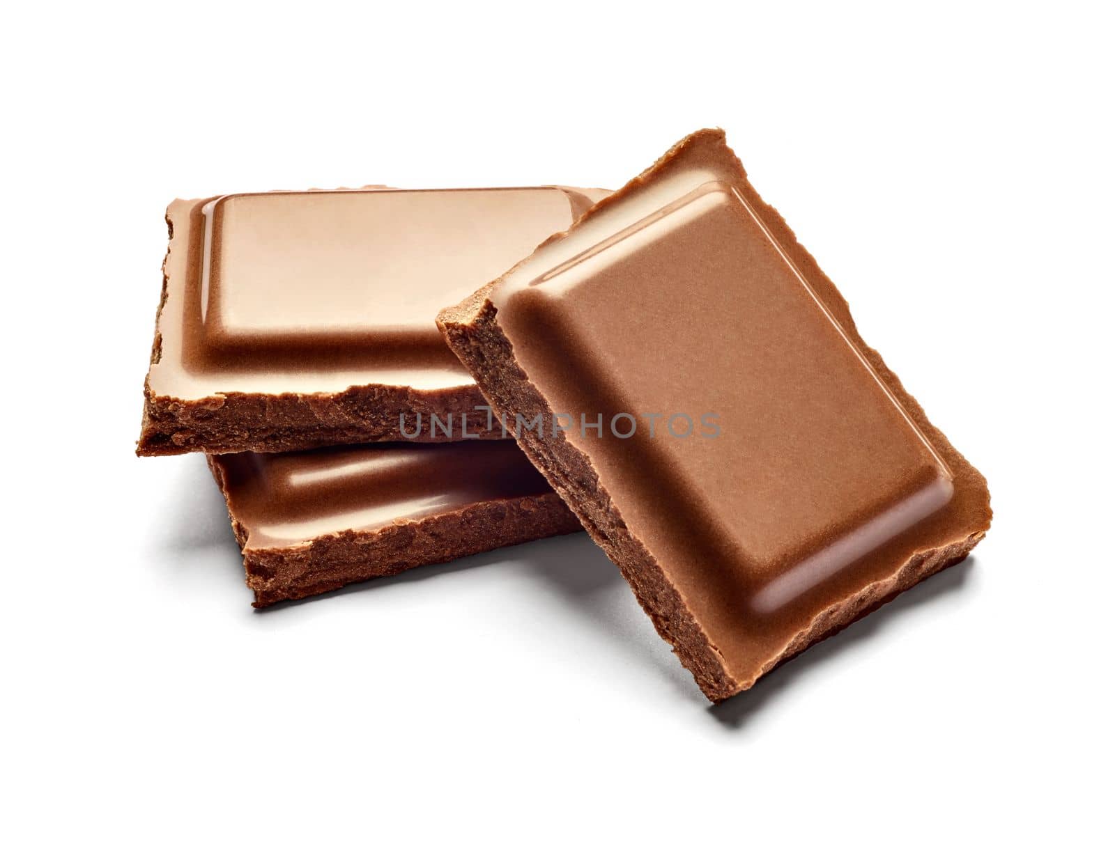 close up of chocolate pieces on white background