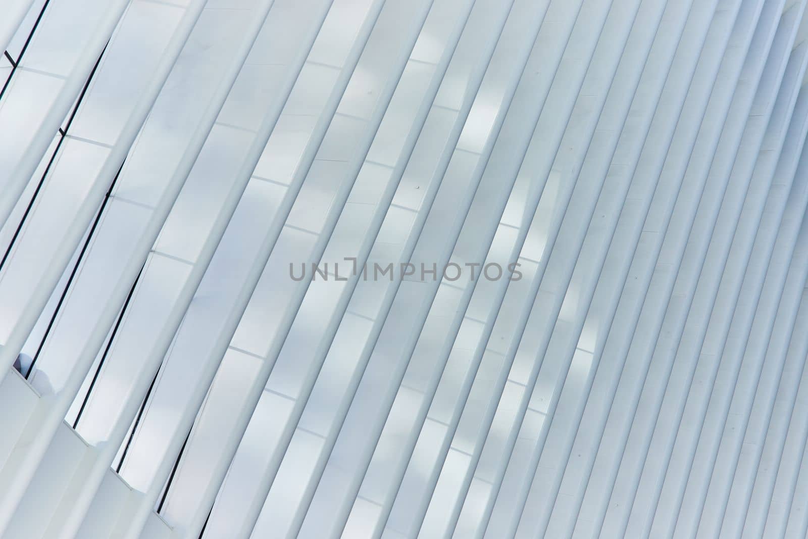 Image of Clean abstract white rib pole architecture at angle with soft light