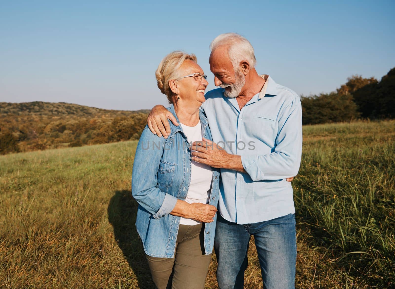 woman man outdoor senior couple happy lifestyle retirement together smiling love hug nature mature by Picsfive